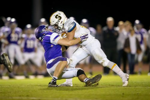 Stone Matthews runs over a defender